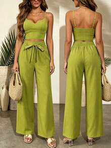 Bộ đồ hai mảnh phong cách Bohemian dành cho nữ, gồm áo hai dây ngắn phối cùng quần ống rộng trang trí nơ. Thiết kế với cạp chun ở phía sau, hoàn hảo cho kỳ nghỉ, bãi biển và trang phục thường ngày. - Màu xanh Ô liu - Xem 1