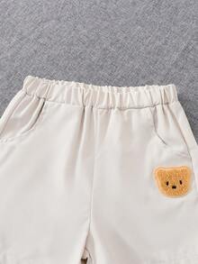 Conjunto de verão infantil com 2 peças: camiseta de manga curta e shorts casuais leves e respiráveis com estampa de urso em cores sólidas. Ideal para presentear e com estilo divertido para momentos de lazer ao ar livre. - Damasco - Ver 10