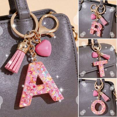 1pc Fashion Keychain Designed Exclusively For Women. This 26-Resin Letter Keychain Features A Pink Chain With A Pink Heart Tassel And Lovely Sequins. It Is Perfect For Decorating Ladies' Handbags, Backpacks And Lunch Boxes, And Can Also Be Used As A DIY Anti-Lost Identifier For Car Keys. A Meaningful Gift For Mother's Day, Teachers' Day, Thanksgiving, Eid Al-Adha And Valentine's Day. Gifts For Mother, Father, Graduation, And Teacher