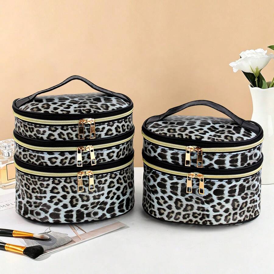 1 chiếc túi đựng mỹ phẩm hình bầu dục in họa tiết da báo bằng chất liệu PU bóng, dung tích lớn, có nhiều ngăn, sang trọng, dùng cầm tay đựng đồ trang điểm, túi đựng đồ vệ sinh cá nhân thời trang khi đi du lịch.