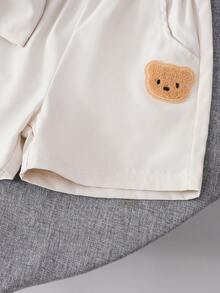 Conjunto de verão infantil com 2 peças: camiseta de manga curta e shorts casuais leves e respiráveis com estampa de urso em cores sólidas. Ideal para presentear e com estilo divertido para momentos de lazer ao ar livre. - Damasco - Ver 4