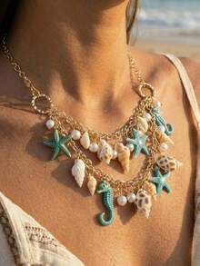 一件夏季海滨贝壳饰品，包含贝壳、海星、珍珠、锁骨链和串珠海洋饰品。 - 彩色 - 查看 3