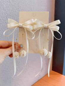 2 piezas Pasadores elegantes y exquisitos para niñas con cadena de moño de tela y borlas - Beis - Ver 6