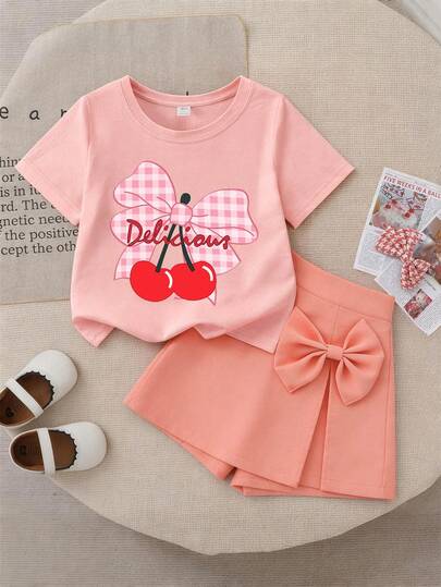 2pcs/Set Girls' Cherry Print T-Shirt And Shorts Skirt, Soft And Comfortable, Casual Style, Fashionable And Personalized Outfit, Suitable For Summer School, Vacation, Party And Daily Wear