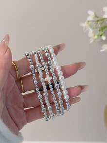 MAPUCE 1件時尚串珠手鍊錶帶，相容於 38/40/41/42/44/45/46/49mm。相容於 Ultra/SE/11/10/9/8/7/6/5/4/3/2/1。多層銀色與珍珠珠飾設計搭配十字圖案，這款可愛的手工編織彈性錶帶是送給女朋友或情侶佩戴的完美禮物 - T096銀色 - 查看 8