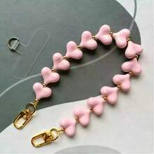 Dây đeo điện thoại độc đáo với hạt hình trái tim màu xanh nhạt như mây điểm xuyết những hạt vàng nhỏ li ti. - Nhiều màu - Xem 7