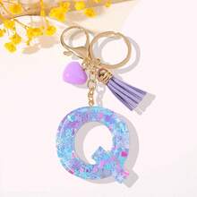 一款专为女性设计的时尚钥匙扣。这款树脂字母钥匙扣配有紫色链条、紫色心形流苏和精美亮片。 - 紫色 - 查看 29