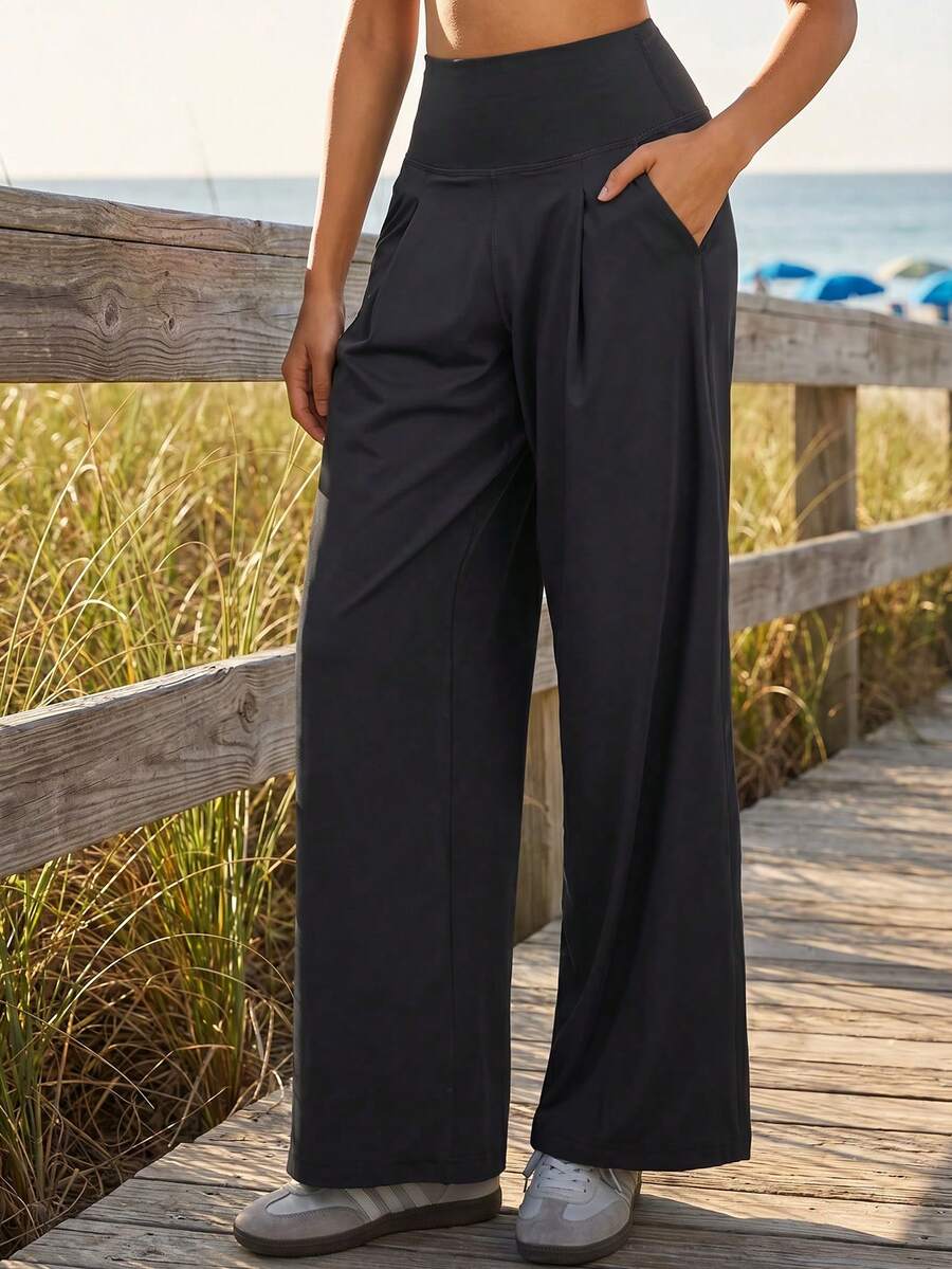 Quần yoga ống rộng chất liệu nylon lụa co giãn cao, nhanh khô, cạp cao, dáng rộng, có túi đựng điện thoại, thích hợp cho nữ tập luyện thể thao. - màu đen - Xem 1
