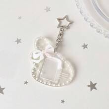 Móc khóa đựng ảnh kiểu Angel Secret - Thiết kế nơ dễ thương, chất liệu acrylic trong suốt lấp lấp, hoàn hảo để đựng ảnh và thẻ ảnh nhỏ. - Màu sắc - Xem 10