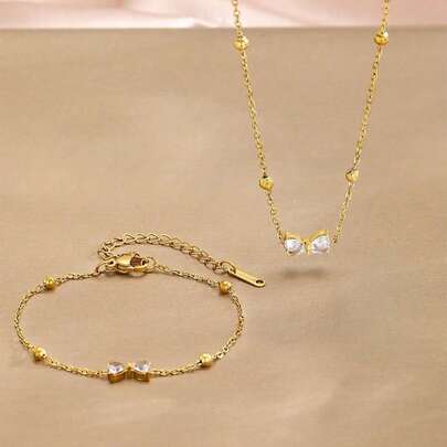 2pcs/Set Exquisite Fashion Gold Stainless Steel Chain Pave Zirconia Bow Pendant Necklace Bracelet Set Suitable For Girls As Daily Wear Jewelry Accessory Gift