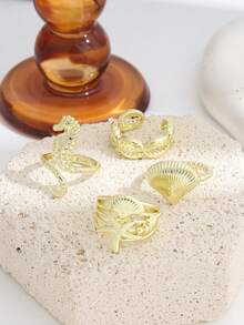 Set de 4 anillos apilables con diseños de la serie oceánica estilo INS, incluyendo caballito de mar, estrella de mar, concha y caracol, para mujeres - Dorado - Ver 2