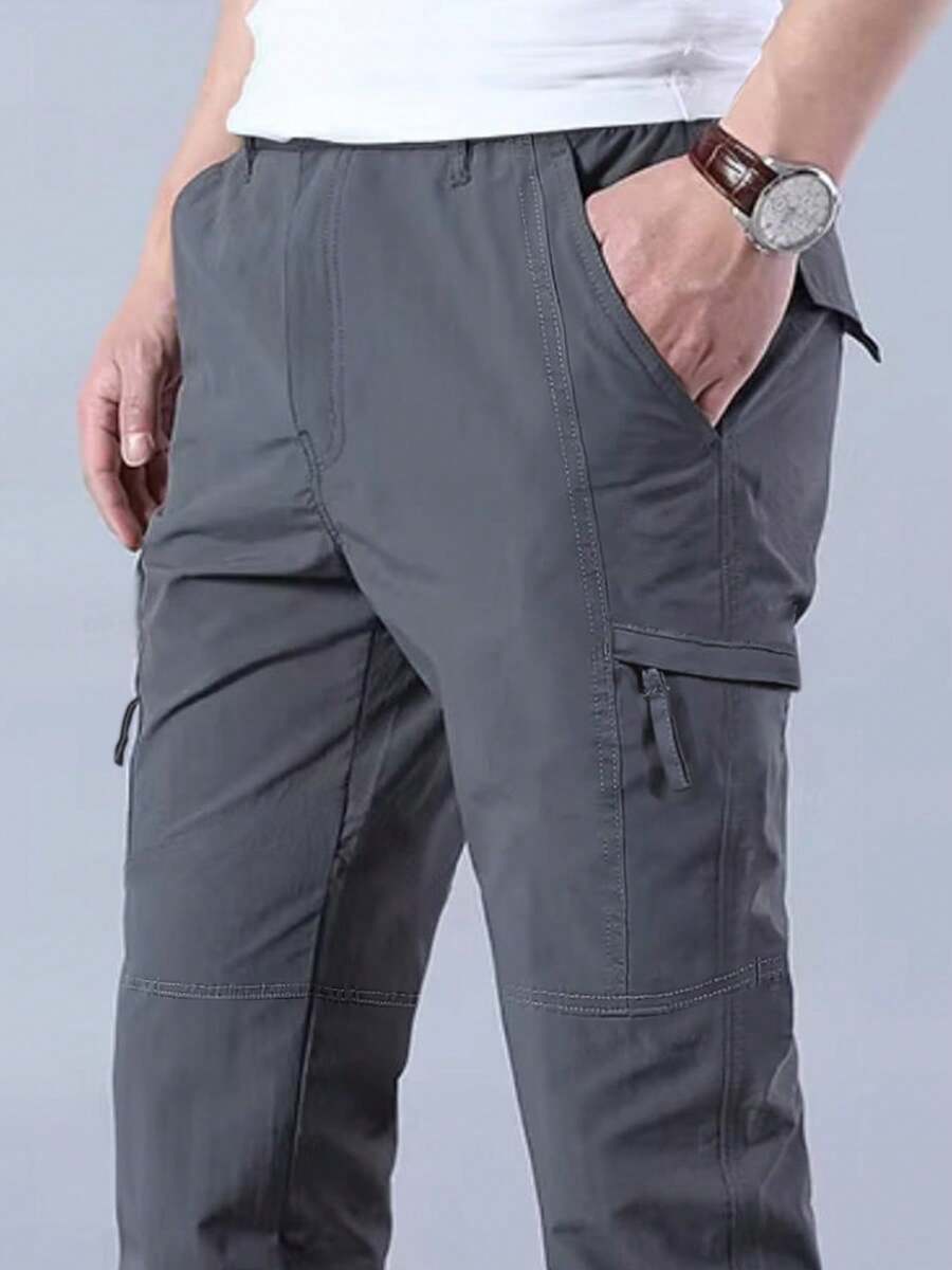 Pantalones de trabajo pantalones al aire libre pantalones de trabajo resistentes al desgaste pantalones de entrenamiento pantalones tácticos de la compañía masculina pantalones de primavera y otoño turismo pantalones al aire libre resistentes al desgaste y flexibilización de múltiples bolsillos - humo gris - Ver 1