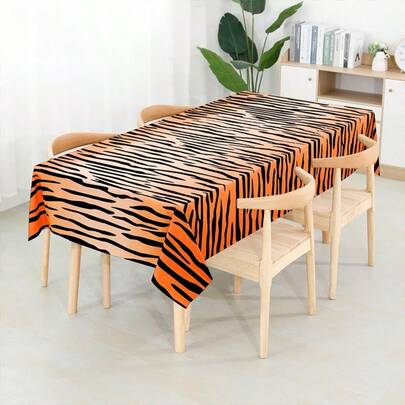 1 chiếc khăn trải bàn dùng một lần in hình hổ, kích thước 137x274cm, chống thấm nước và chống dầu, thiết kế màu cam và đen nổi bật, dễ lau chùi, phù hợp cho tiệc theo chủ đề rừng rậm, trang trí sự kiện in hình động vật.