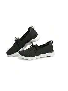 Skechers Women's Breathable Mesh Cushioned Slip-On Walking Sneakers - Black and White - View 1