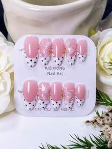 10 pièces de faux ongles en forme d'amande faits à la main, style français blanc avec des pois noirs et un design sculpté en 3D. Adopte une base d'ongle nude peinte à la main, assortie aux bords français blancs et aux pois noirs, et décoré de sculptures de fleurs à trois pétales faites à la main et de pistils. Élégant, romantique et minimaliste, ces patchs d'ongles de luxe, sexy et haut de gamme conviennent à la vie quotidienne, aux rendez-vous, aux concerts et aux occasions professionnelles légères, et constituent un excellent cadeau pour les femmes et les filles. - Multicolore - Voir 10