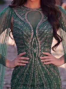 Faeriesty Đầm dạ hội sang trọng dành cho nữ – Đầm đuôi cá đính sequin màu xanh ngọc lục bảo, tay áo kiểu áo choàng lãng mạn, điểm xuyết đá quý lấp lánh, thích hợp cho các sự kiện trang trọng, tiệc prom và đám cưới. - Màu xanh lá cây đậm - Xem 6