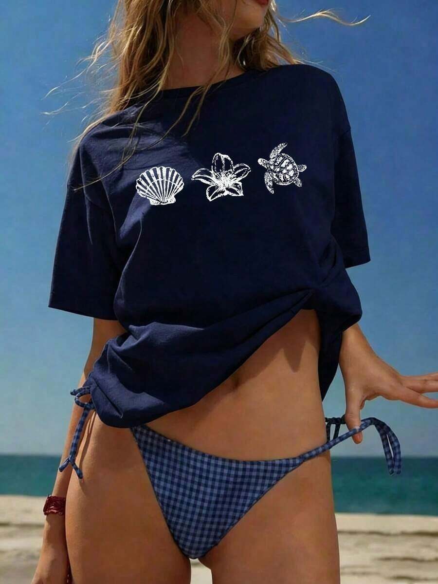 Camiseta de manga corta de verano para mujer, de ajuste holgado, con cuello redondo, en color azul claro, con estampados casuales de letras, animales marinos, caparazón de tortuga y flores, ideal para uso diario y vacaciones - Negro - Ver 1