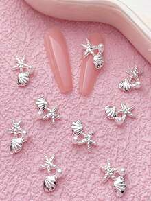 10 pièces Charms d'art des ongles à thème estival, avec des motifs d'étoiles de mer et de coquillages comme designs principaux. La collection comprend une variété de styles, y compris des designs en or, argent, perle, étoile de mer et coquillage. Ces décorations d'ongles en alliage 3D. - Multicolore - Voir 6