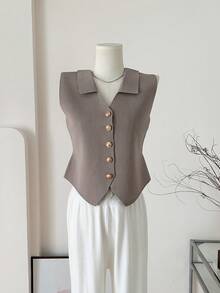 1 chiếc áo vest dệt kim không tay phối màu đen, trắng và nâu nhạt, kiểu dáng Pháp, ôm sát, cổ giả, thích hợp cho lễ hội và du lịch. - Nhiều màu - Xem 18