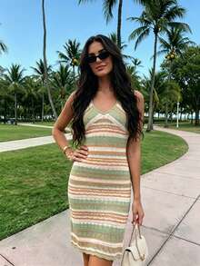 Đầm dệt kim hở lưng cổ chữ V mùa hè mới, thiết kế gợi cảm khoe xương quai xanh, mang đến cảm giác nghỉ dưỡng, phù hợp cho đi biển, hẹn hò, dự tiệc hoặc mặc thường ngày. - Nhiều màu - Xem 4