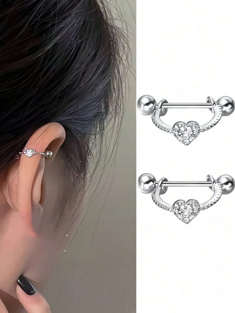Un par de pendientes de botón en forma de corazón y forma de U de plata para mujer, engastados con brillantes de strass y con cierre de giro - Plateado - Ver 1