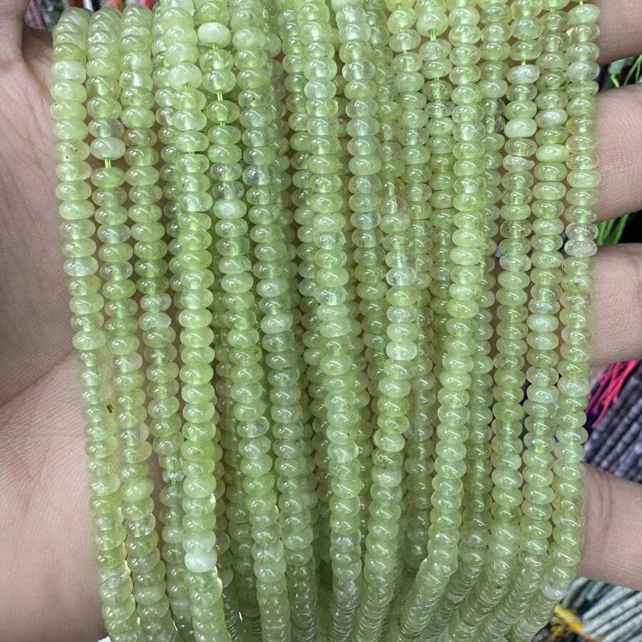 Best-Selling 2x4mm Premium Optimized Fruit Green Abacus Beads In Flat Round Shape, Loose Beads.Crafted From High-End, Light-Luxury Materials, It Perfectly Blends Fashion Aesthetics With Elegant Style.It Can Be Widely Used In Various DIY Jewelry-Making Occasions, Suitable For The Production Of All Kinds Of Accessories Such As Bracelets, Bangles, Necklaces, Earrings, Ear Studs, Drop Earrings, Anklets, And Pendants.At The Same Time, It Can Also Serve As An Embellishment For Clothing, Adding A Unique Charm To The Overall Look.Its Neutral Design  Perfectly Meets The Needs Of Both Men And Women, Making It A Fashionable Choice For Holiday Gifts Or Visiting Friends.The Length Of Each One Is Approximately 15inch. - 2x4 mm, khoảng 157 miếng - Xem 1