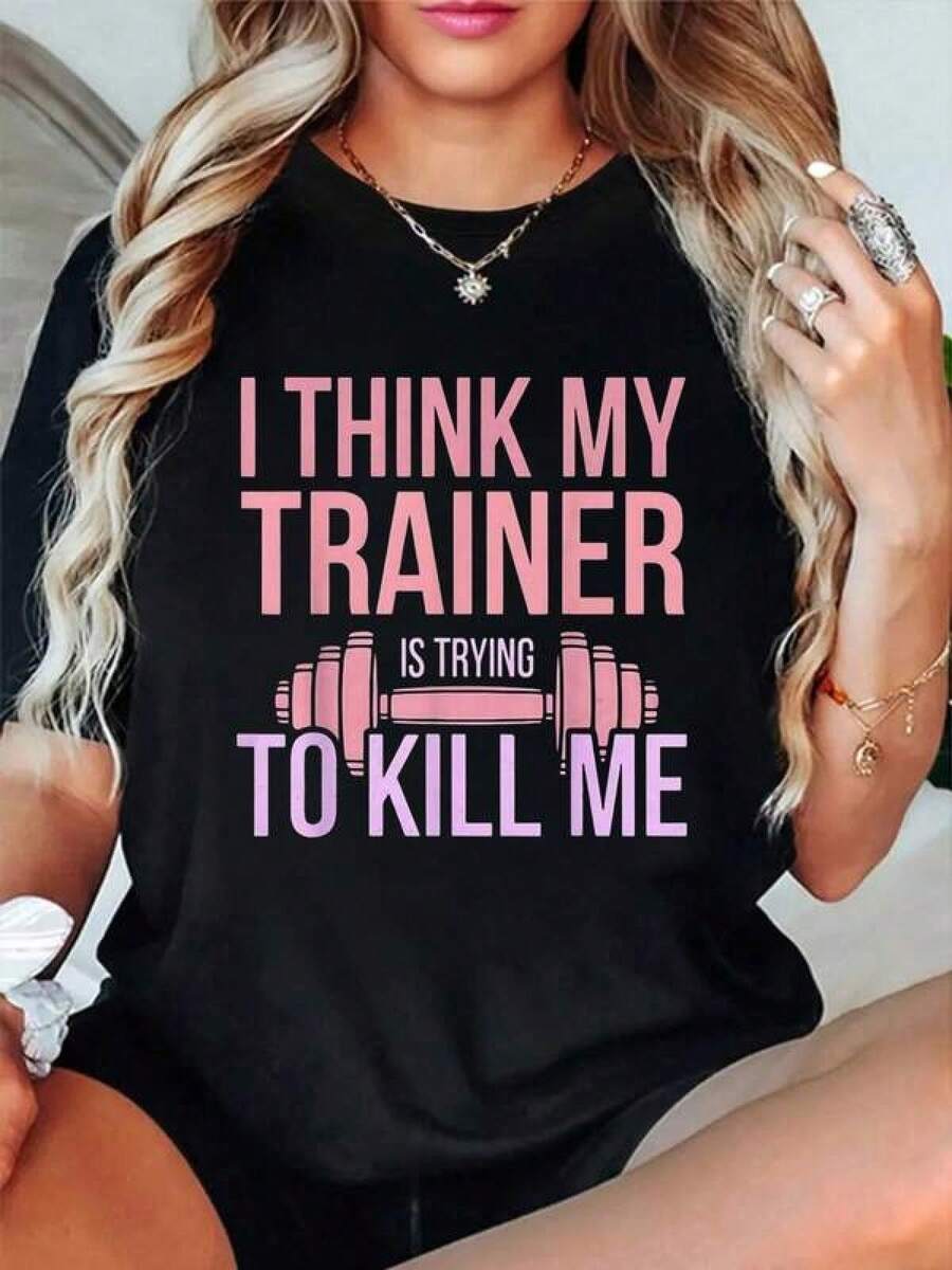 100% Cotton Trainer Trying To Kill Me Funny Workout Gym Fitness T-Shirt Short Sleeve Crew Neck Casual Top For Summer & Spring, Women's And Men's Graphic T-Shirt, Classic Unisex Graphic Print T-Shirt – Perfect For Everyday Wear. Casual Summer Shirt Made Of Cotton: Soft, Lightweight And Comfortable To Wear. Stylish, Casual Design UYIE - Black - View 1