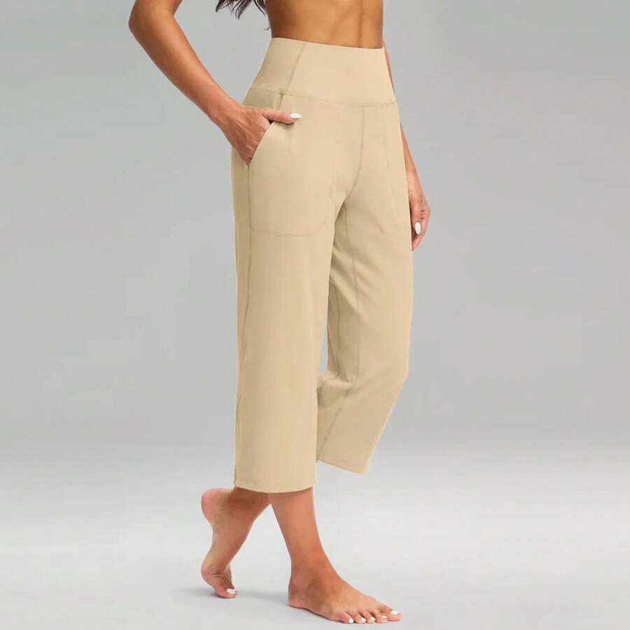 Pantalones elásticos de cintura alta 3/4 para mujer, pantalones capri informales de ajuste activo, pantalones con bolsillos, pantalones deportivos informales de color sólido - Marrón - Ver 1