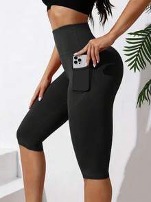 Pantalones capri de yoga de cintura media para mujer con dos bolsillos, pantalones deportivos elásticos, transpirables y de secado rápido, adecuados para correr y para el gimnasio - Negro - Ver 1