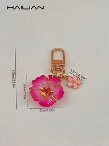 HAILIAN Llavero con flor linda, colgante de bolso de resina de hibisco con degradado y mini flor colgante, llavero chapado en oro, adecuado para billetera, mochila, bolso de mano, decoración de llaves de coche, gran regalo para mujeres y niñas (disponible en rosa/rojo) - Rosa Fucsia - Ver 7