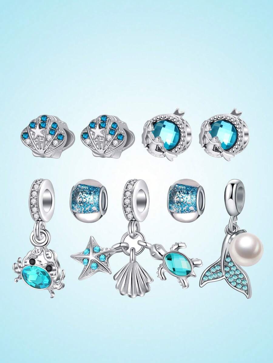Bộ dụng cụ tự làm vòng tay hạt cườm chủ đề đại dương, gồm kim loại bạc sáng bóng và đá zirconia màu ngọc lam, thích hợp để làm vòng tay kiểu dây chuyền, tươi mới và sống động, tái hiện hoàn hảo không khí của một bãi biển mùa hè. - Nhiều màu - Xem 1