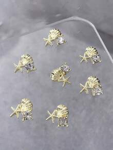 10 pièces Charms d'art des ongles à thème estival, avec des motifs d'étoiles de mer et de coquillages comme designs principaux. La collection comprend une variété de styles, y compris des designs en or, argent, perle, étoile de mer et coquillage. Ces décorations d'ongles en alliage 3D. - Multicolore - Voir 4