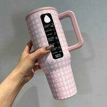 HYDROO-JUGG, 40 Oz, Powder White/Black/Caffeine, Insulated Cup Ice Booster Cup, Mug Water Cup, Great Gift Item. Three Patterns Of Checkered Designs, With Perfect Appearance. The Powder White Pattern Has A Soft And Cute Girlish Charm, The Black And White Pattern Is Versatile, And The Coffee Pattern Is Retro And Elegant. The Vacuum Insulation Layer Design Effectively Locks In Temperature And Freshness. It Keeps Drinks Frozen In Summer And Warm In Winter. The Non-Slip Handle Fits The Hand Shape, Providing A Comfortable Grip. The Leak-Proof Sealing Cover Is Tightly Attached, The Straw Is Detachable, Making Cleaning Convenient. It Doesn't Leak And Is More Secure To Carry. The 40 Oz Large Capacity Is Suitable For Students, Office Workers, Fitness Enthusiasts, And Can Be Used In Various Scenarios Such As In Cars, At Work, At Home, And Outdoors. It Is Practical And Highly Stylish For Gift Giving During Festivals. - Pink and White Checkered - View 3