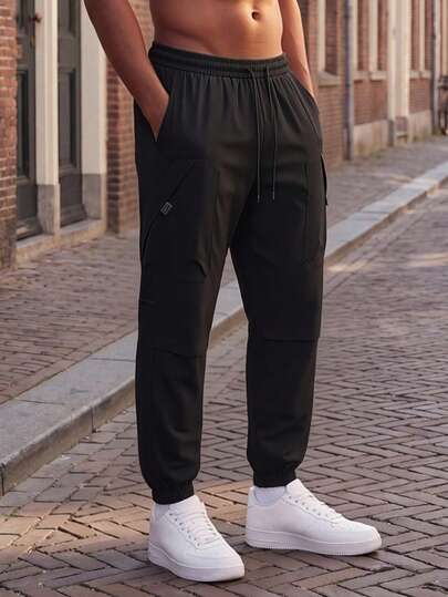Plus Size Men's Multi-Pocket Sweatpants, Elastic Waist Drawstring Functional Casual Sweatpants, Loose Fit Ankle-Tied Sporty Trousers