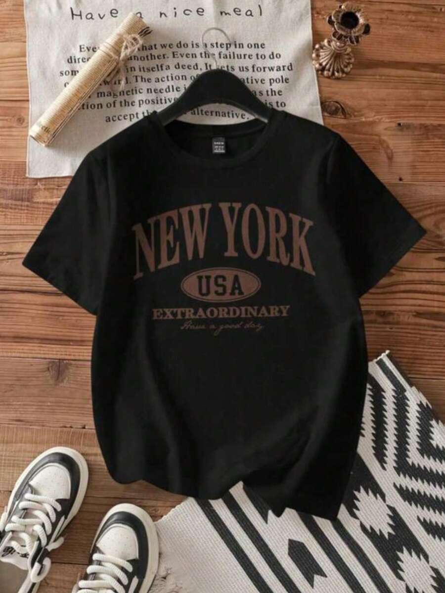 MPLSL|Mujer002 Camiseta de Mujer Casual Versátil Cómodo y Elegante Camiseta negra con el emblema de NEW YORK USA y la frase EXTRAORDINARY Have a good day , un artículo atractivo para el estilo urba - Negro - Ver 1