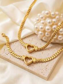 Bộ trang sức tối giản bằng thép không gỉ gồm dây chuyền và vòng tay, thiết kế hình trái tim rỗng, thích hợp cho nữ giới đeo đi dự tiệc, họp mặt, du lịch hoặc những buổi đi chơi thời trang. - Vàng - Xem 9