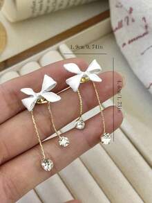 1 Đôi bông tai dài đính pha lê màu trắng, kiểu dáng thanh lịch, dễ thương, có nơ và tua rua, phù hợp cho các bạn gái tuổi teen đeo hàng ngày, dự lễ hội và tiệc tùng. - Cây cung - Xem 5