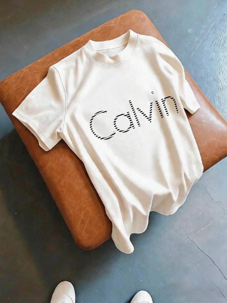 T-shirt ample et décontracté à col rond et manches courtes, imprimé de lettres d'été polyvalent, doux, respirant et confortable. Hauts basiques décontractés pour sorties quotidiennes, shopping de rue pour femmes - Blanc - Voir 1