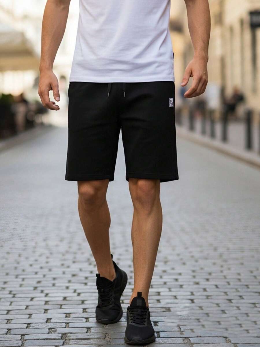 Pantalones cortos negros con cordón y cintura elástica para hombres, pantalones cortos deportivos casuales y sueltos, transpirables, versátiles para uso diario, correr, fitness, estilo callejero - Negro - Ver 1