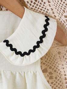 Vestido blanco sin mangas para niñas con cuello Peter Pan holgado y ribete ondulado negro, media botonadura delantera y falda línea A de cintura alta relajada - Albaricoque - Ver 5