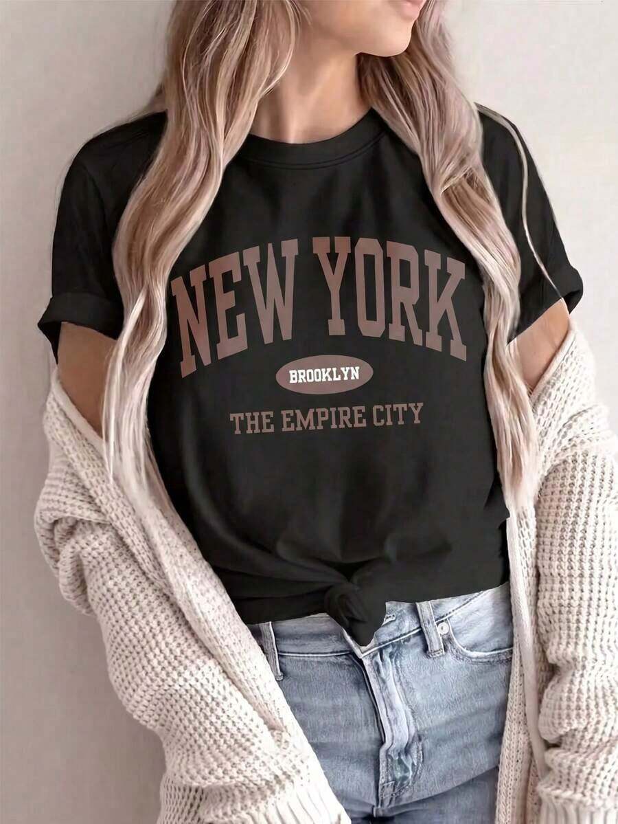 2026Nueva camiseta de manga corta con cuello redondo para mujeres, diseño primavera-verano, con impresión sencilla de las letras NEY YORK y combinación perfecta, transpirable y absorbe la sudor. Envío directo desde nuestro almacén local, un modelo para parejas, ideal para que lo usen en pareja. - Negro - Ver 1