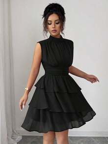 Vestido corto italiano de mujer de gasa con cuello pequeño, cintura recogida, volantes en el bajo y sin mangas, para uso casual, viajes, tardes de té, en colores lisos, para primavera/verano - Negro - Ver 9