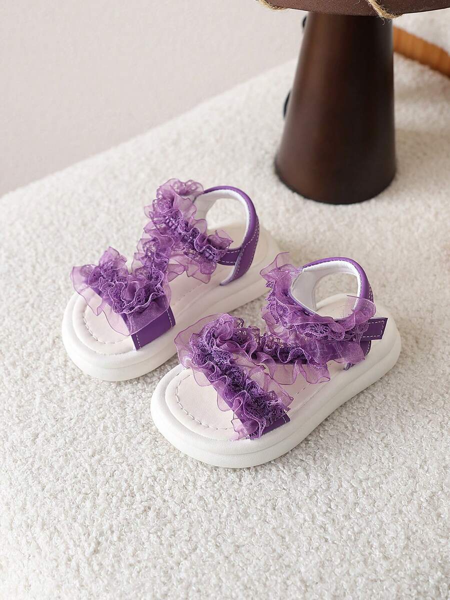 1 Đôi dép xăng đan đi biển cho bé gái, kiểu công chúa, có nơ, đế mềm chống trơn trượt, thích hợp cho mùa hè. - Màu tím - Xem 1