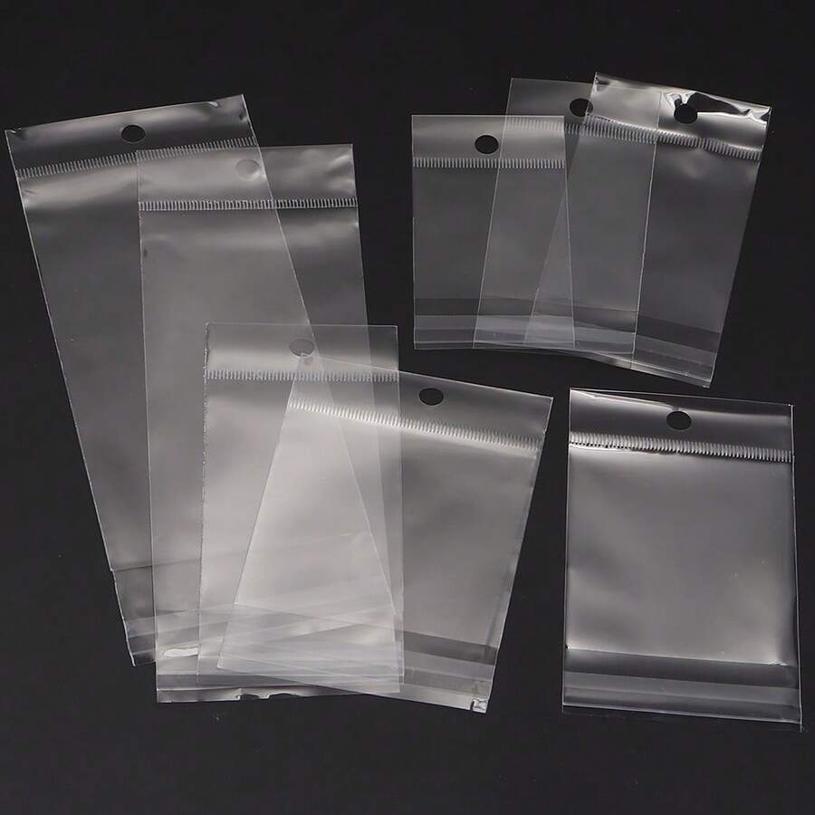 100入/包 透明OPP自黏封口袋，附吊孔，適用於珠寶展示與禮品包裝，耐用透明塑膠可重複使用封口袋，零售收納整理理想選擇，安全包裝，時尚外觀