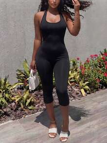 Bộ jumpsuit lửng ôm sát màu đen cổ yếm hở lưng gợi cảm DOUCIU dành cho hộp đêm. - màu đen - Xem 5