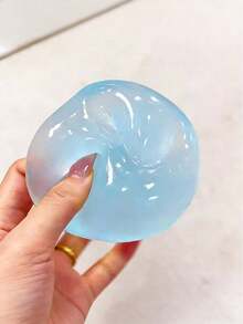 1个蓝色椰子油慢回弹减压球——一款有助于缓解焦虑的玩具，也是完美的派对礼物。这款圆形柔软的挤压球旨在缓解压力；它是理想的桌面减压玩具，也是节日礼物、生日礼物、复活节惊喜或派对新奇小礼物的绝佳选择。趣味十足，可爱迷人，令人爱不释手！ - 彩色 - 查看 6