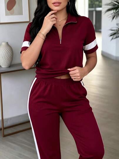 Bộ đồ nữ 2 mảnh mùa xuân/hè, kiểu dáng thường ngày năng động, áo tay ngắn cổ khóa kéo phối màu tương phản và quần ống rộng cạp cao.