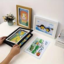 可折叠磁性A4卡通主题艺术相框，正面开口设计。非常适合展示黑白照片。也适合展示青少年的艺术作品和照片。是装饰家庭办公室或作为生日礼物的绝佳选择。卡通墙饰。 - A - 查看 5