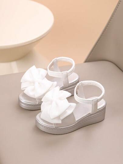 1 Pair European And American New Style Sweet Girls' White Big Bow Tie Wedge Sandals, Girls' High Heel Shoes, Soft Bottom Non-Slip Open Toe Princess Shoes, Fashion Versatile Girls' Elastic Back Strap Platform Sandals, Classic Breathable Girls' Sandals, Suitable For Daily Wear And Outdoor Activities