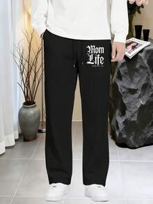A pair of Mom Life Gothic Typography Print men's black drawstring waist wide-leg sweatpants, loose straight-leg pants with side pockets, ultra-comfortable breathable fabric, suitable for year-round sports, daily wear, and street-style casual wear. - ブラック - チェックする 1